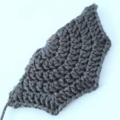 Finished folded crochet bat wing with scalloped points