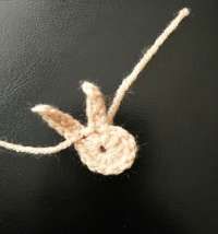 Beige crochet bunny head with two long ears