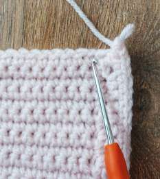 Crochet hook at the end of the band, finishing the shell edging