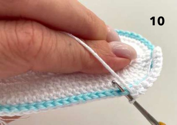 First round of white single crochet worked up from the edge of the sole