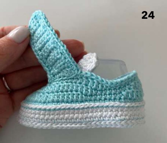 Right crochet sneaker with its aqua strap standing up