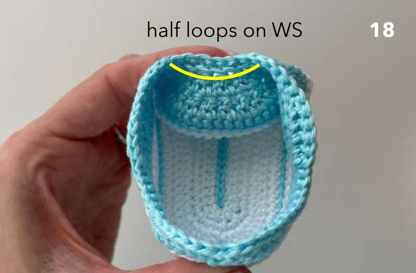 Inside of the crochet sneaker with the free loops for the tongue marked in yellow