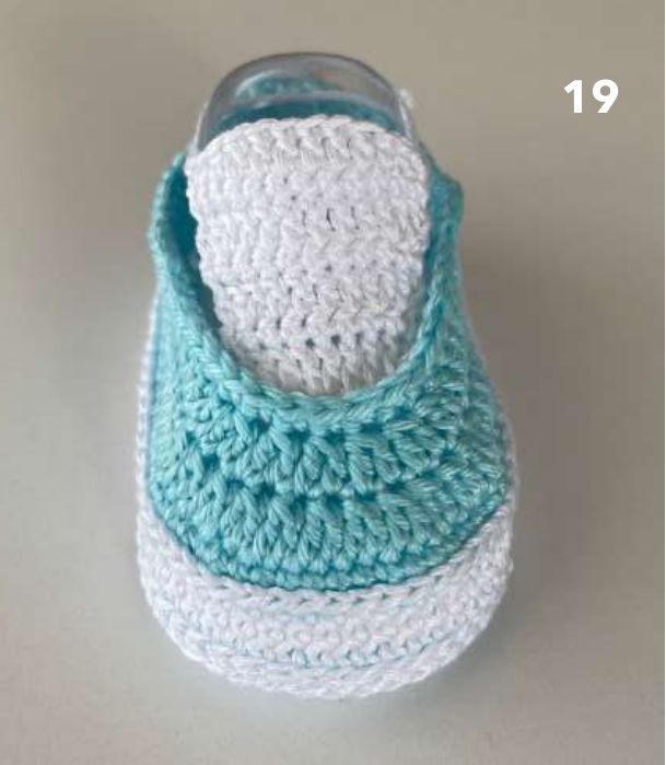 Aqua crochet sneaker on a clear shoe form with a white tongue