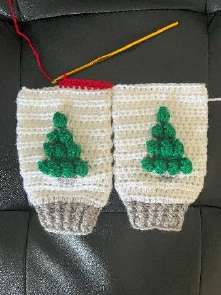 The first red round joining the two crochet legs at the top