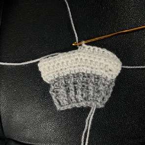 White crochet leg with the silver trunk finished