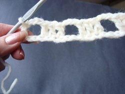 Cream crochet row of double crochet blocks and chain spaces