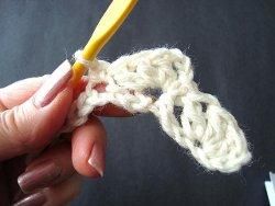 Hook making the first fan of the crazy shell stitch on a chain