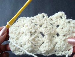 Cream crochet swatch of slanted fans in crazy shell stitch