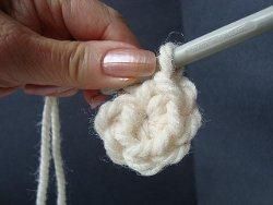 Small cream crochet circle pulled closed in the middle
