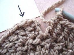 Arrow pointing to the right stitch for joining a crochet round
