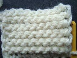 Cream swatch of Tunisian crochet with upright stitches