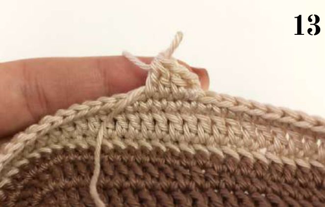 Beige yarn joined at the top edge of the shoe base