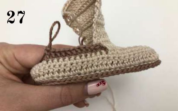 Side view of the crochet shoe with brown yarn joined beside the tongue