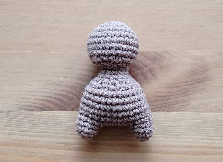Crochet bear head sewn onto the body, before the ears, muzzle and arms